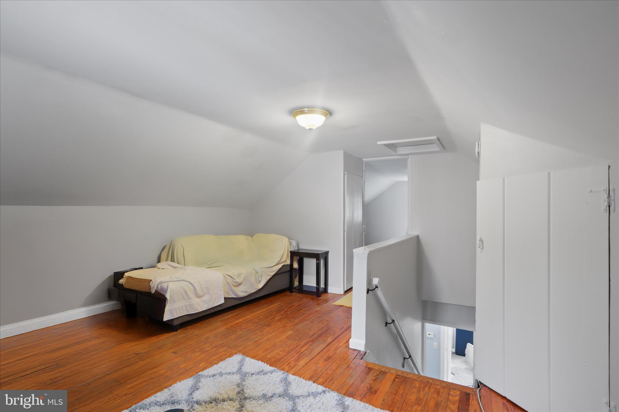 10602 Edgewood Avenue Silver Spring, MD 20901 - Photo 23 of 66 a bedroom with furniture and a wooden floor