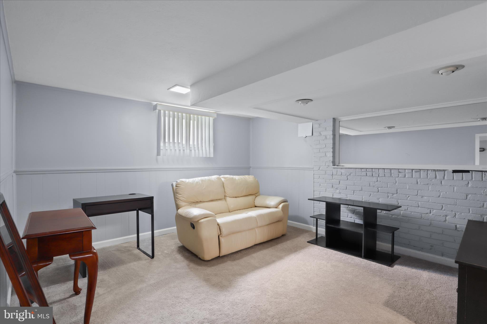 10602 Edgewood Avenue Silver Spring, MD 20901 - Photo 28 of 66 a living room with furniture and a table