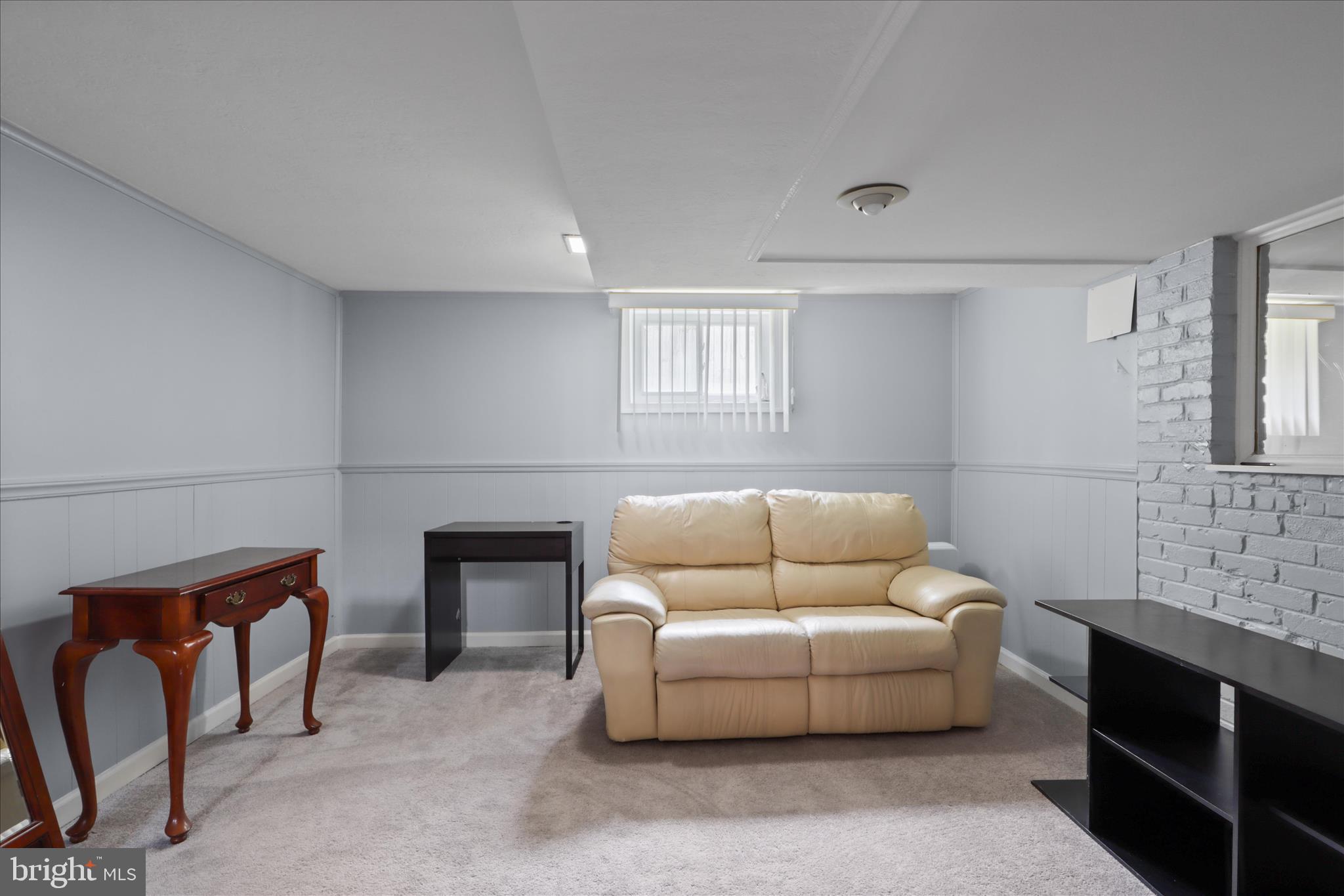 10602 Edgewood Avenue Silver Spring, MD 20901 - Photo 29 of 66 a living room with furniture and a fireplace