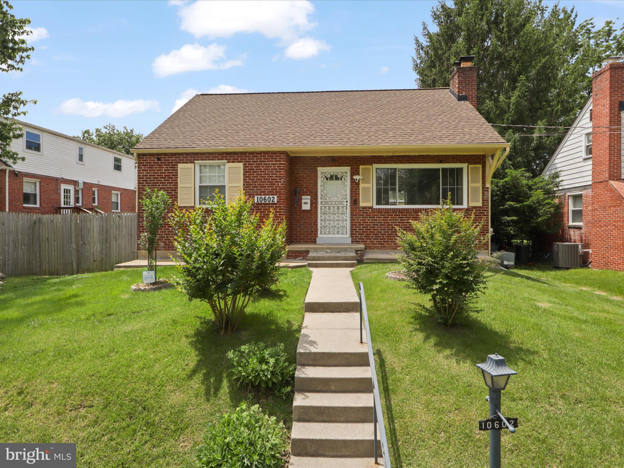10602 Edgewood Avenue Silver Spring, MD 20901 - Photo 3 of 66 a front view of a house with a garden