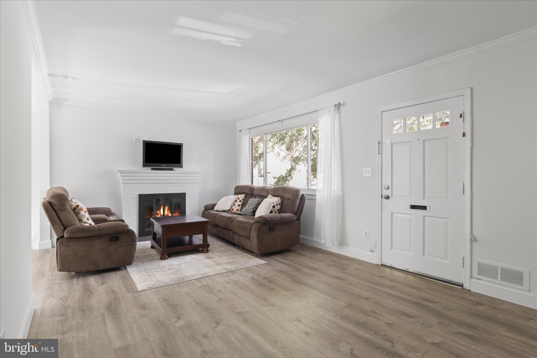 10602 Edgewood Avenue Silver Spring, MD 20901 - Photo 37 of 66 a living room with furniture and a fireplace