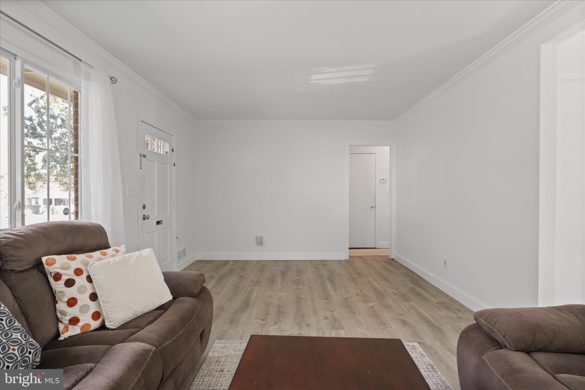 10602 Edgewood Avenue Silver Spring, MD 20901 - Photo 39 of 66 a living room with furniture and window