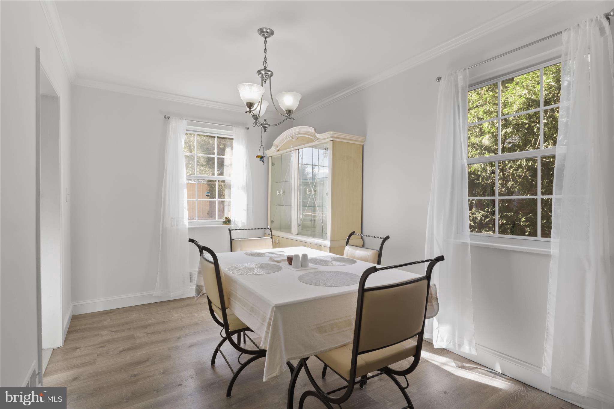 10602 Edgewood Avenue Silver Spring, MD 20901 - Photo 40 of 66 a view of a dining room with furniture window and outside view