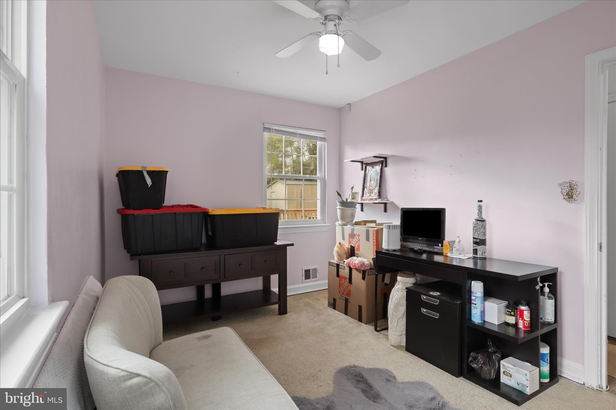 10602 Edgewood Avenue Silver Spring, MD 20901 - Photo 46 of 66 a living room with furniture and a flat screen tv
