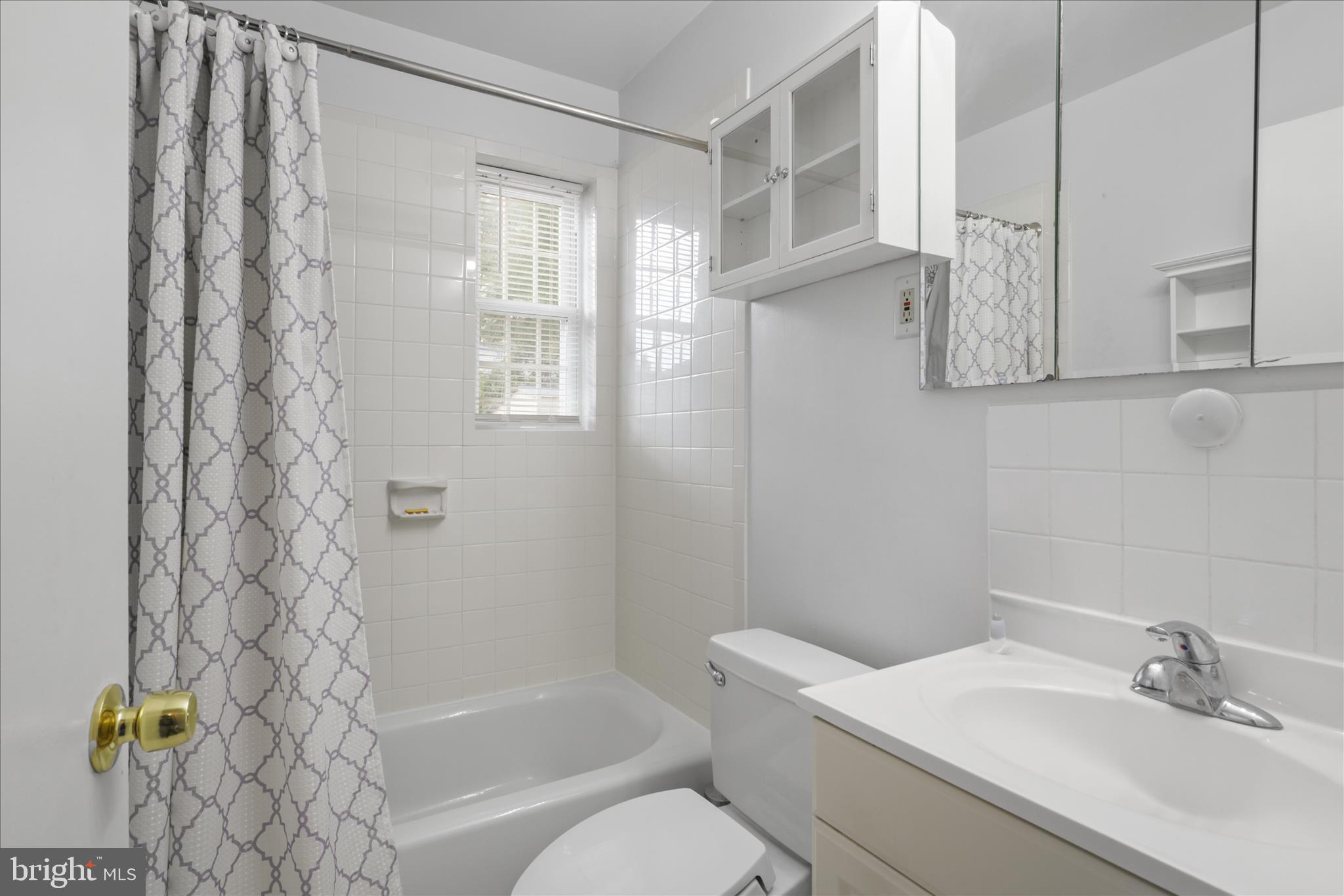10602 Edgewood Avenue Silver Spring, MD 20901 - Photo 47 of 66 a bathroom with a sink toilet and shower