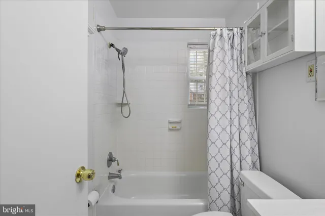 a picture of a bench in front of a wall