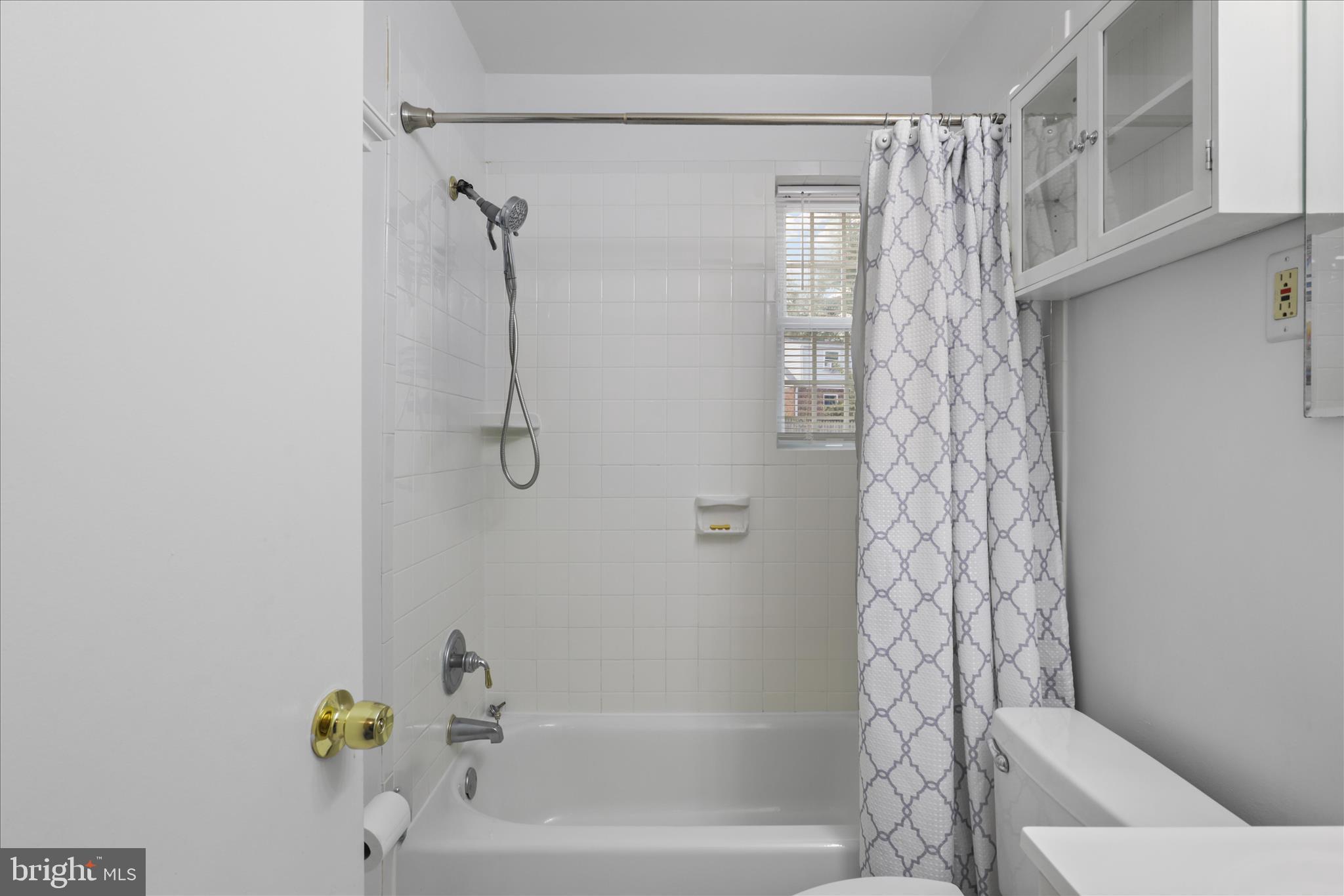 10602 Edgewood Avenue Silver Spring, MD 20901 - Photo 49 of 66 a bathroom with a shower and a toilet