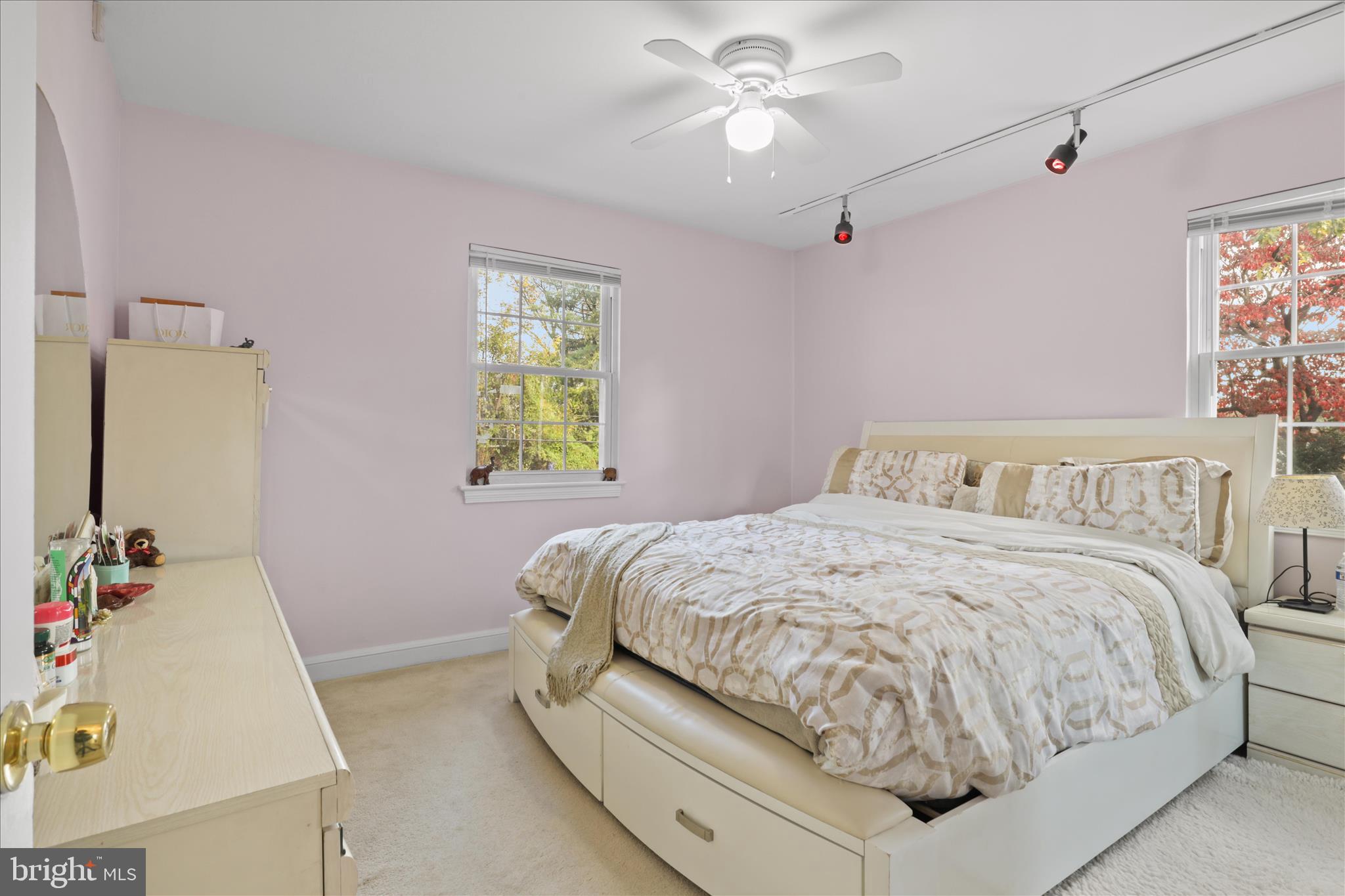 10602 Edgewood Avenue Silver Spring, MD 20901 - Photo 50 of 66 a bedroom with a bed and a chandelier