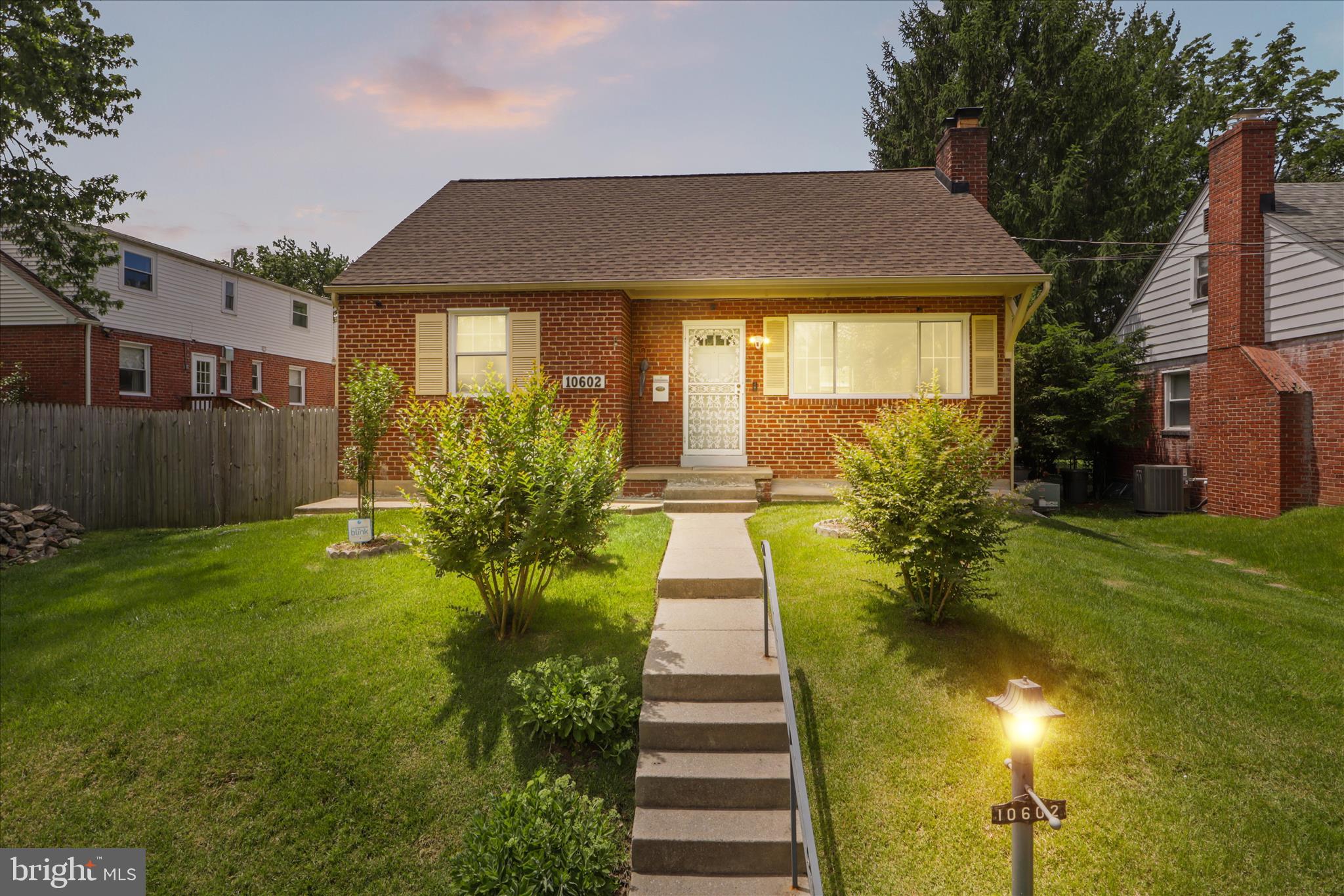 10602 Edgewood Avenue Silver Spring, MD 20901 - Photo 5 of 66 a front view of a house with a yard