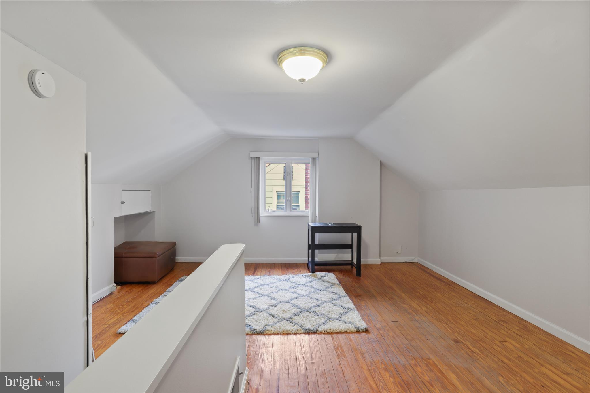 10602 Edgewood Avenue Silver Spring, MD 20901 - Photo 53 of 66 a view of workspace with wooden floor and lounge chair