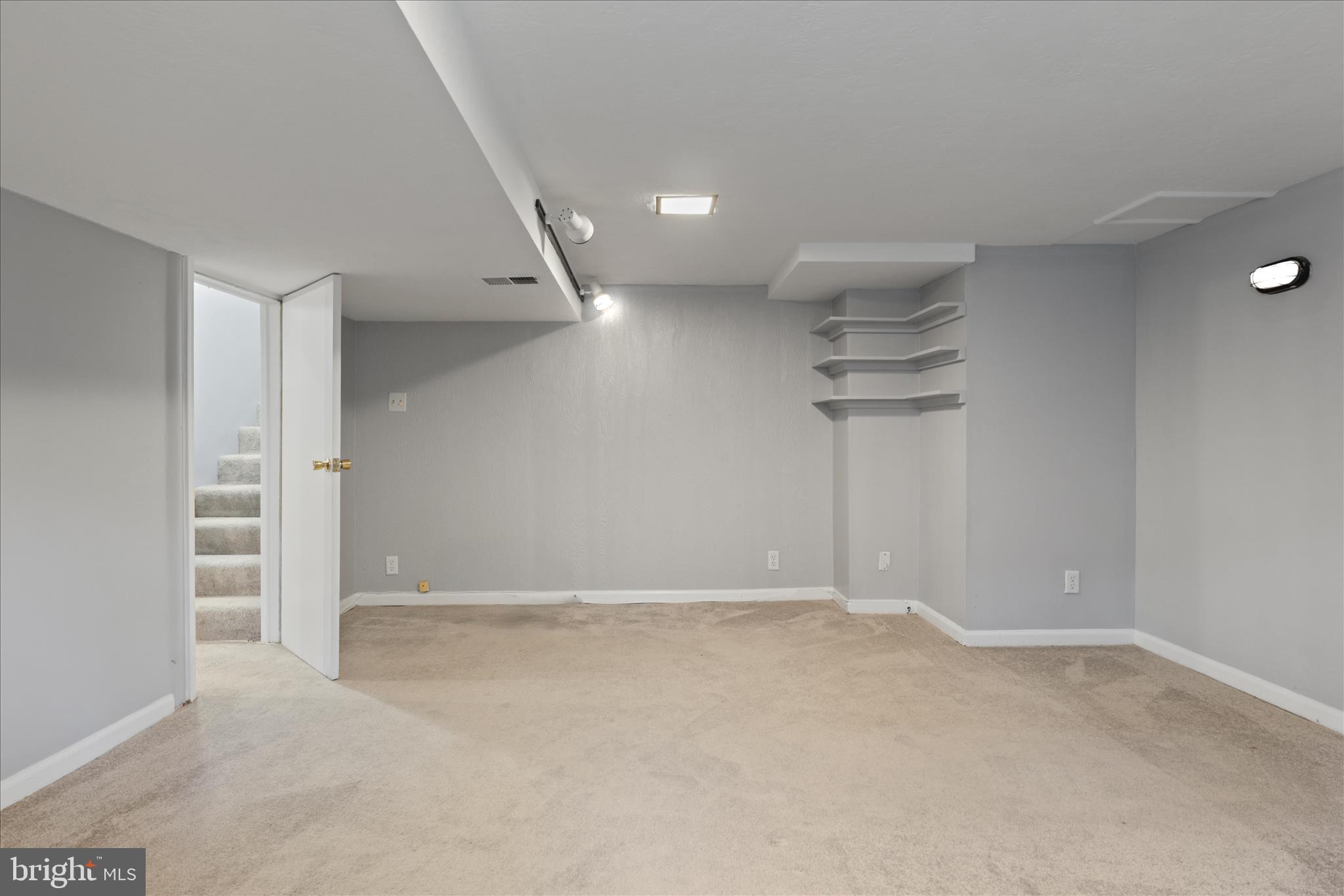 10602 Edgewood Avenue Silver Spring, MD 20901 - Photo 57 of 66 an empty room with a ceiling fan and window
