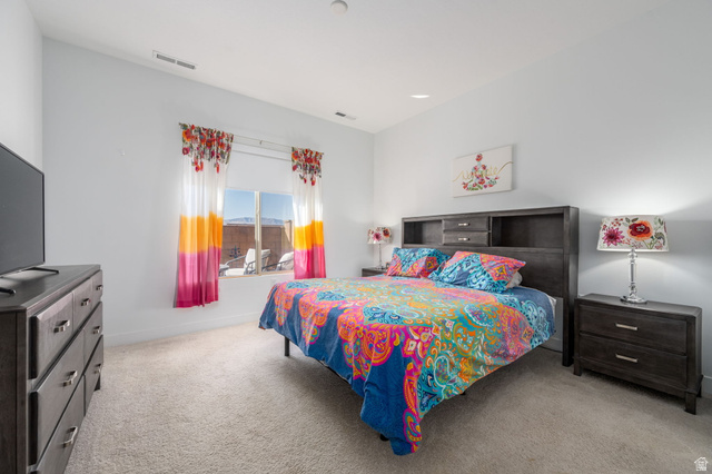 4708 Martin Drive St. George, UT 84790 - Photo 14 of 28 Bedroom featuring light carpet and recessed lighting