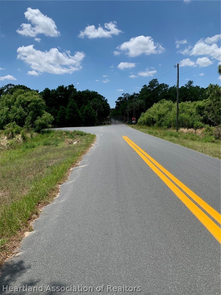 3485 West County Line Road Avon Park, FL 33825 - Photo 9 of 9 a view of a street with a yard