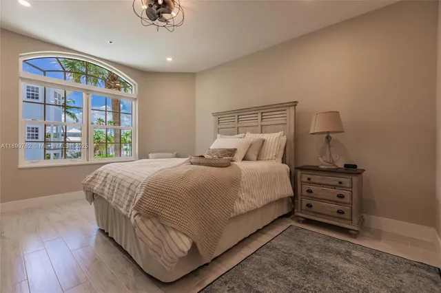 a living room with furniture a rug and a flat screen tv