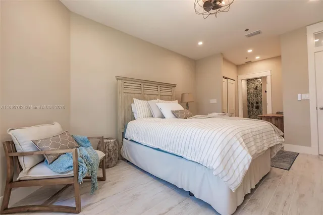 a kitchen with stainless steel appliances kitchen island granite countertop a large counter top a sink stainless steel appliances and cabinets