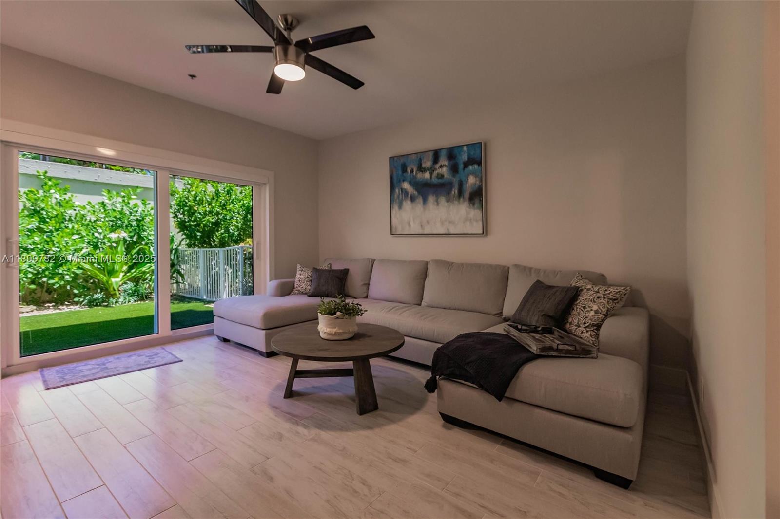 117 Ocean Key Way Jupiter, FL 33477 - Photo 23 of 57 a living room with furniture and a window