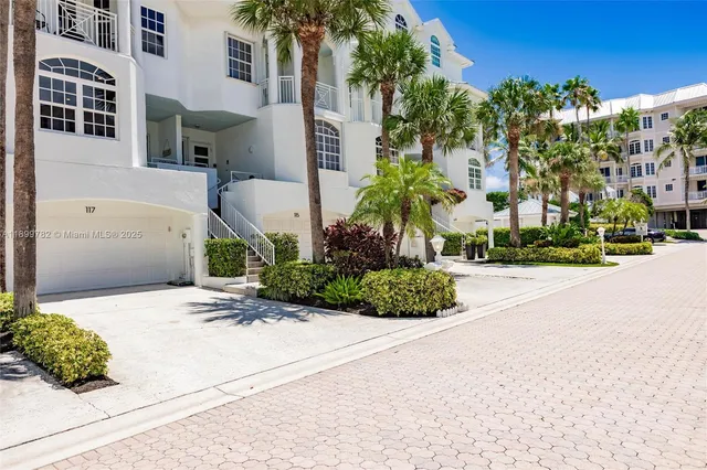 a bedroom with two beds and a large window