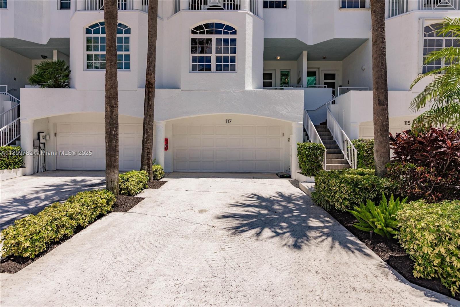 117 Ocean Key Way Jupiter, FL 33477 - Photo 4 of 57 a front view of a house with a yard