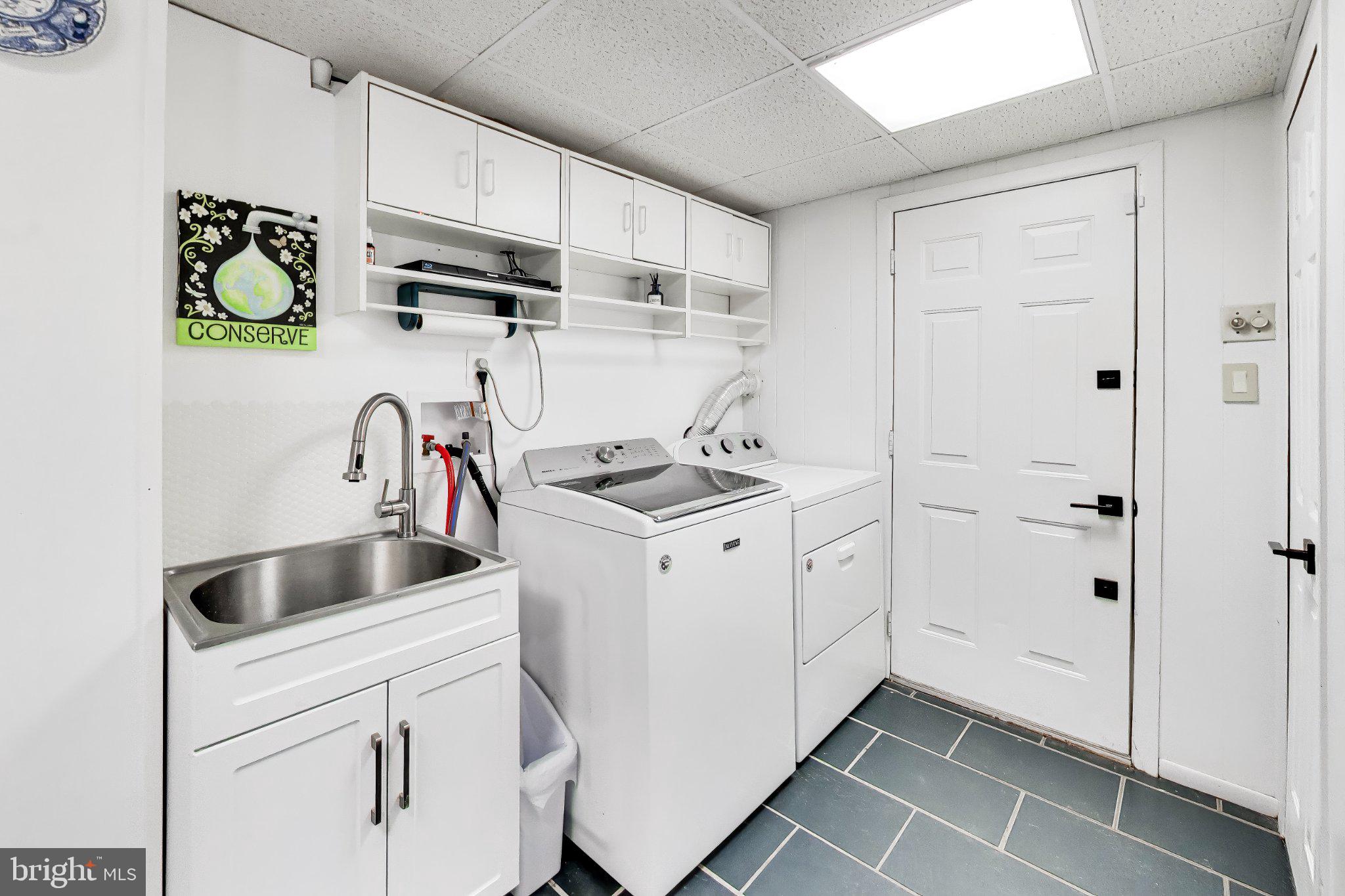 14216 Alderton Road Silver Spring, MD 20906 - Photo 30 of 63 a kitchen with appliances cabinets and a sink