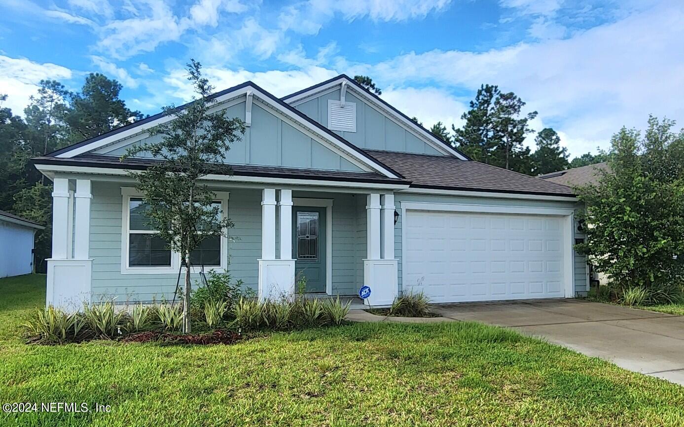 289 Narvarez Circle St. Augustine, FL 32084 - Photo 1 of 25 a front view of a house with garden