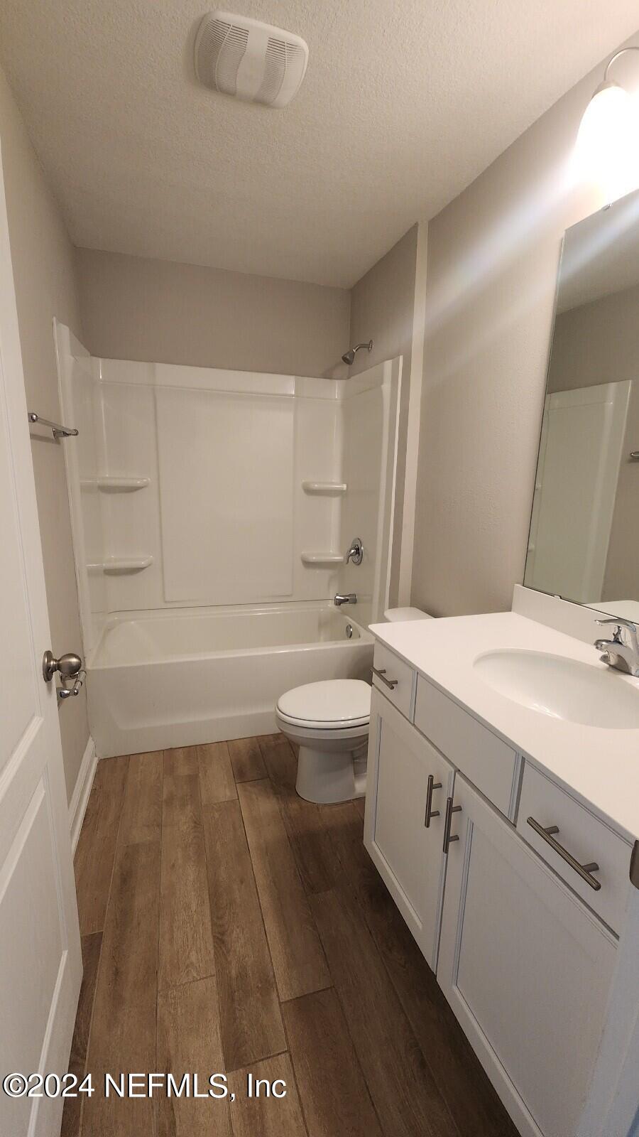 289 Narvarez Circle St. Augustine, FL 32084 - Photo 17 of 25 a bathroom with a sink a toilet and shower