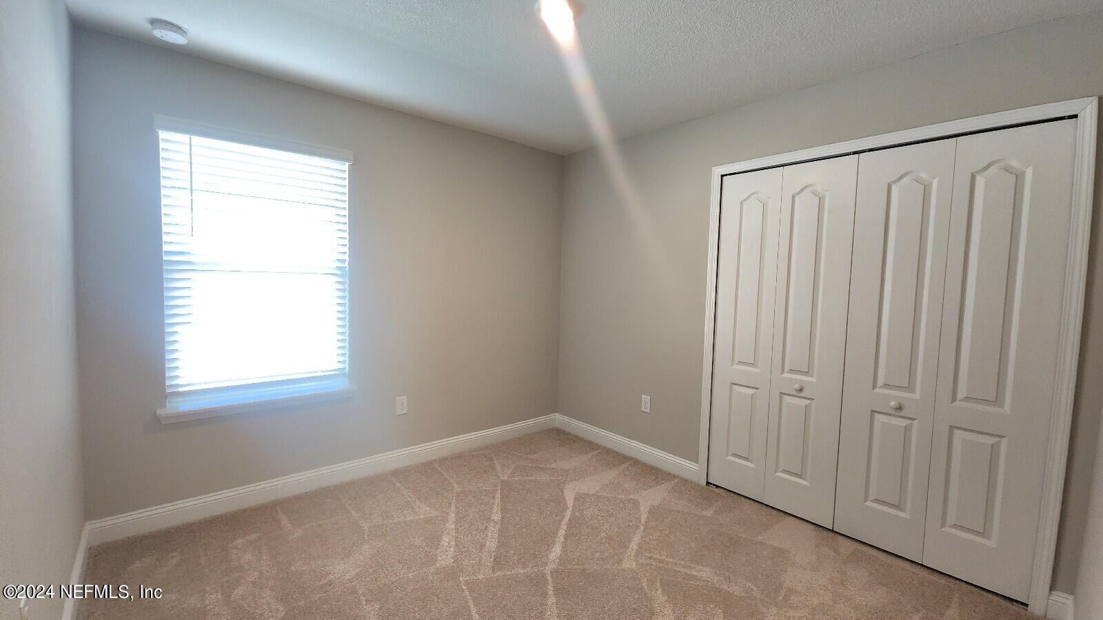 289 Narvarez Circle St. Augustine, FL 32084 - Photo 18 of 25 a view of an empty room with a window
