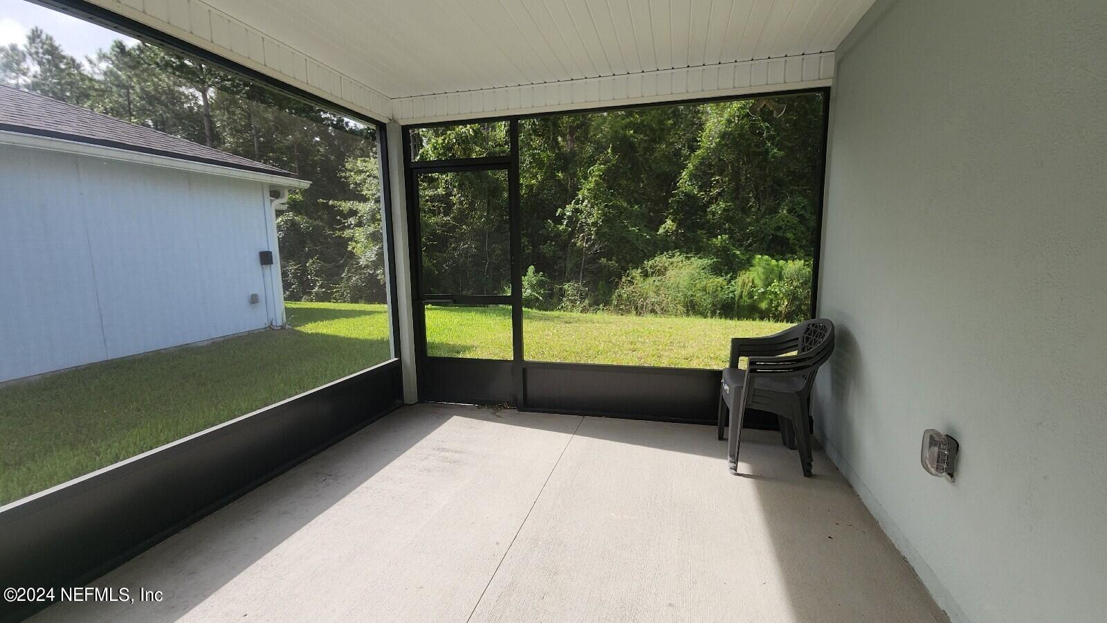 289 Narvarez Circle St. Augustine, FL 32084 - Photo 19 of 25 a bedroom with a bed and a view of balcony