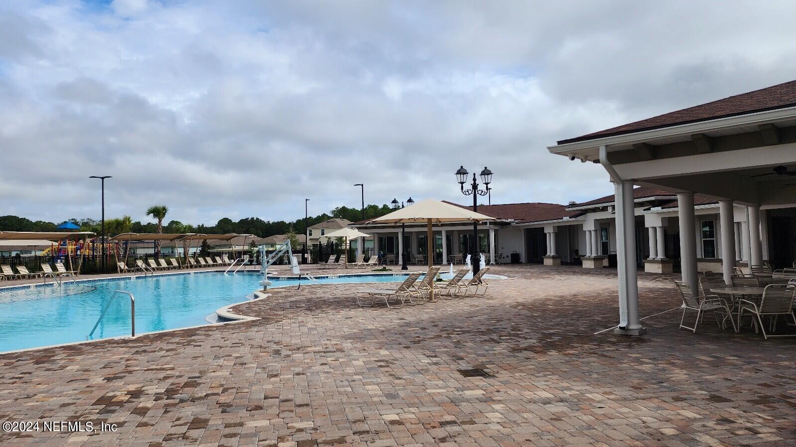 289 Narvarez Circle St. Augustine, FL 32084 - Photo 21 of 25 a view of a house with swimming pool and sitting area