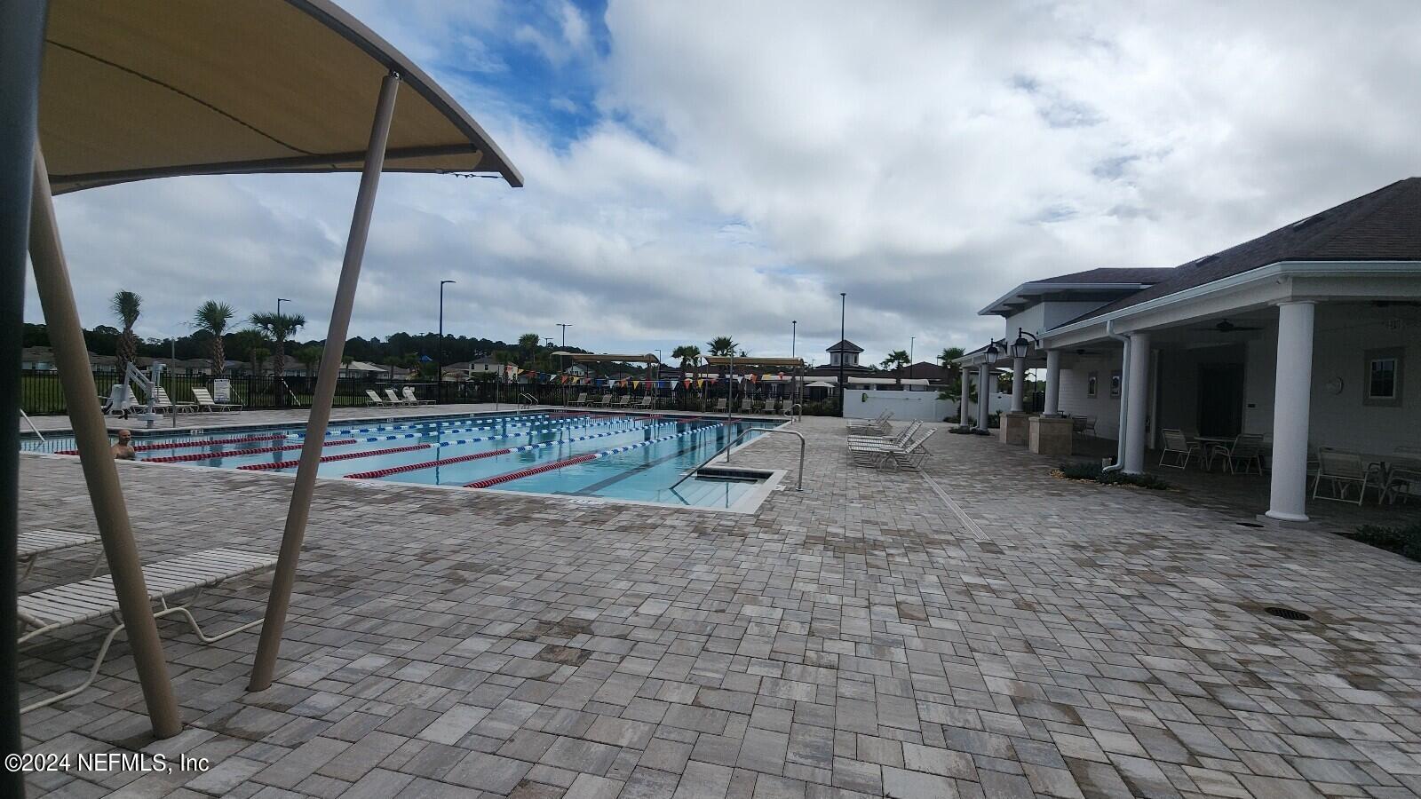 289 Narvarez Circle St. Augustine, FL 32084 - Photo 22 of 25 a view of a swimming pool with a chair