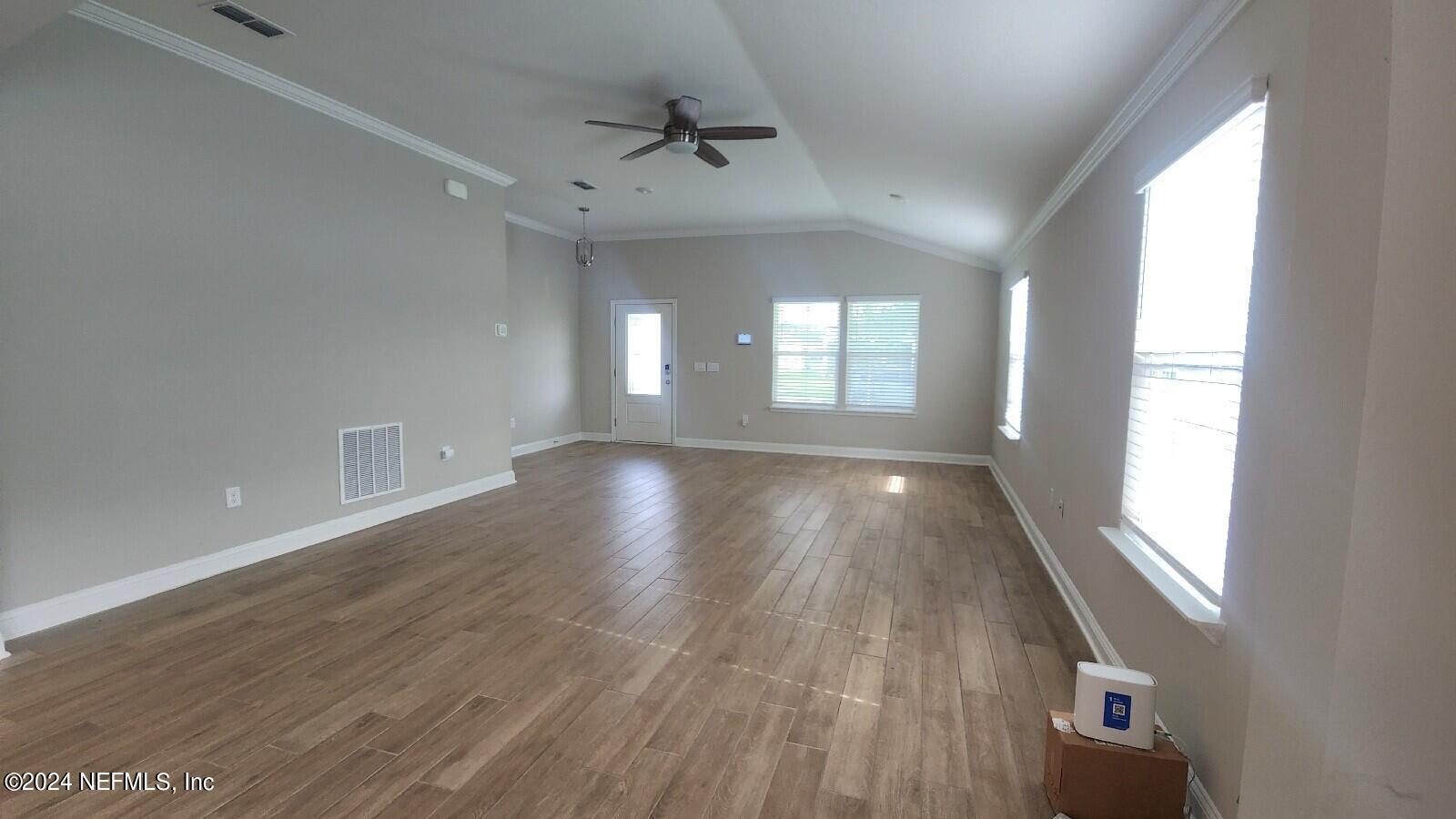 289 Narvarez Circle St. Augustine, FL 32084 - Photo 3 of 25 a view of hallway with windows and wooden floor