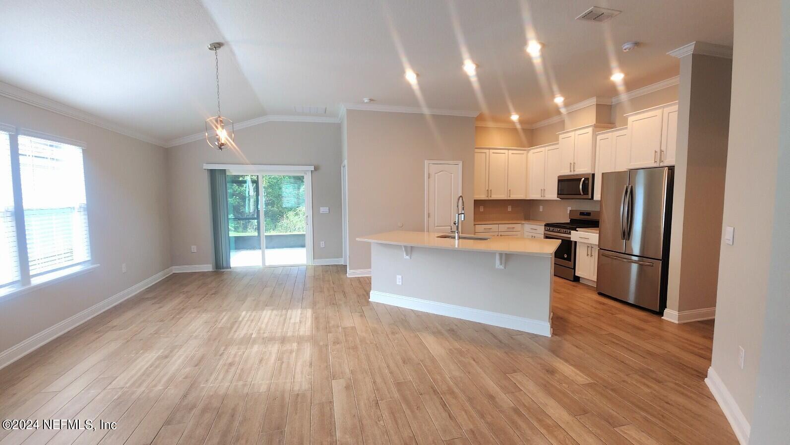 289 Narvarez Circle St. Augustine, FL 32084 - Photo 5 of 25 a kitchen with stainless steel appliances a refrigerator sink and microwave