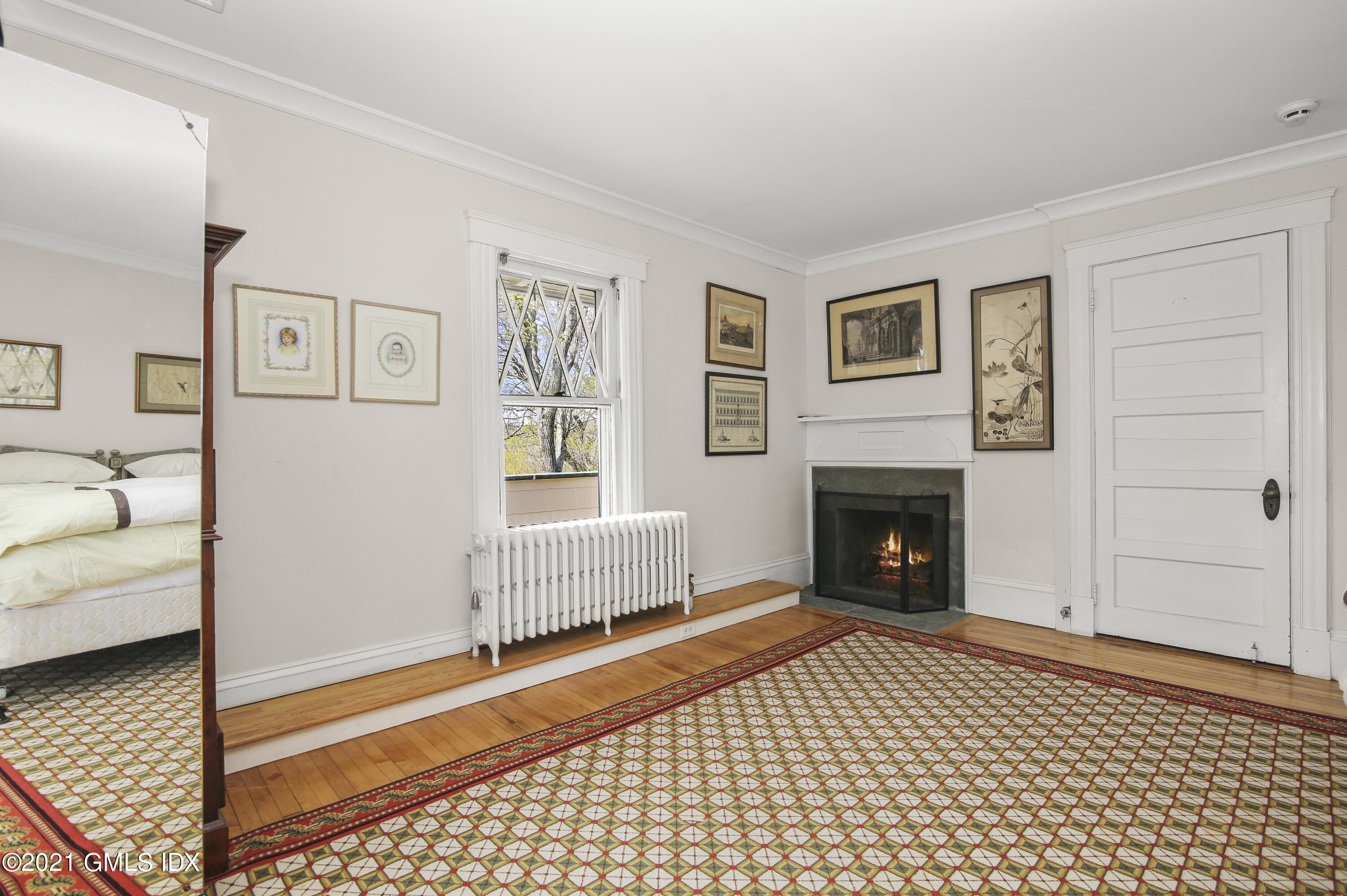 97 Hillcrest Park Road Old Greenwich, CT 06870 - Photo 15 of 25 a living room with furniture and a fireplace
