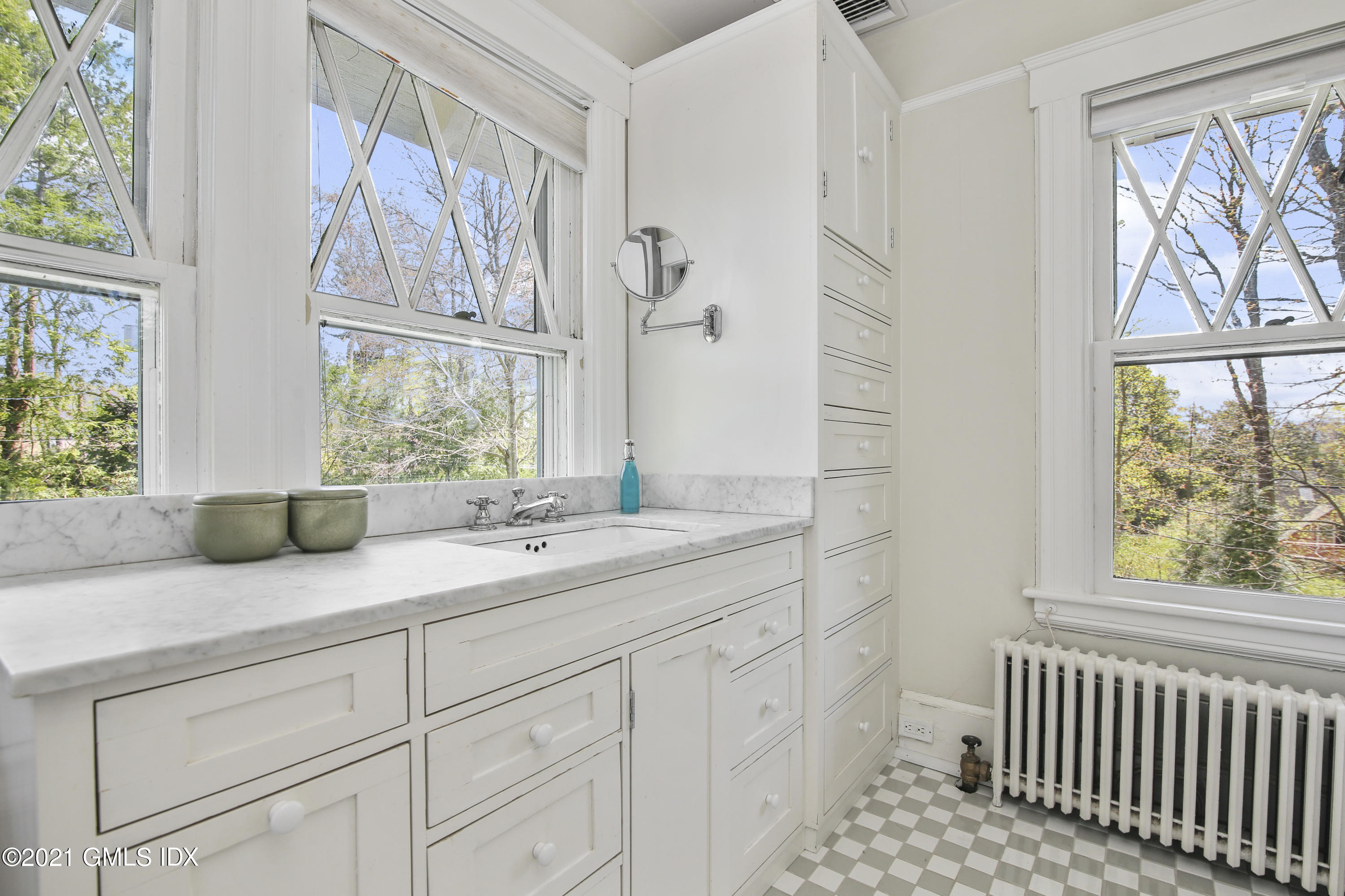 97 Hillcrest Park Road Old Greenwich, CT 06870 - Photo 16 of 25 a bathroom with a granite countertop sink and a window