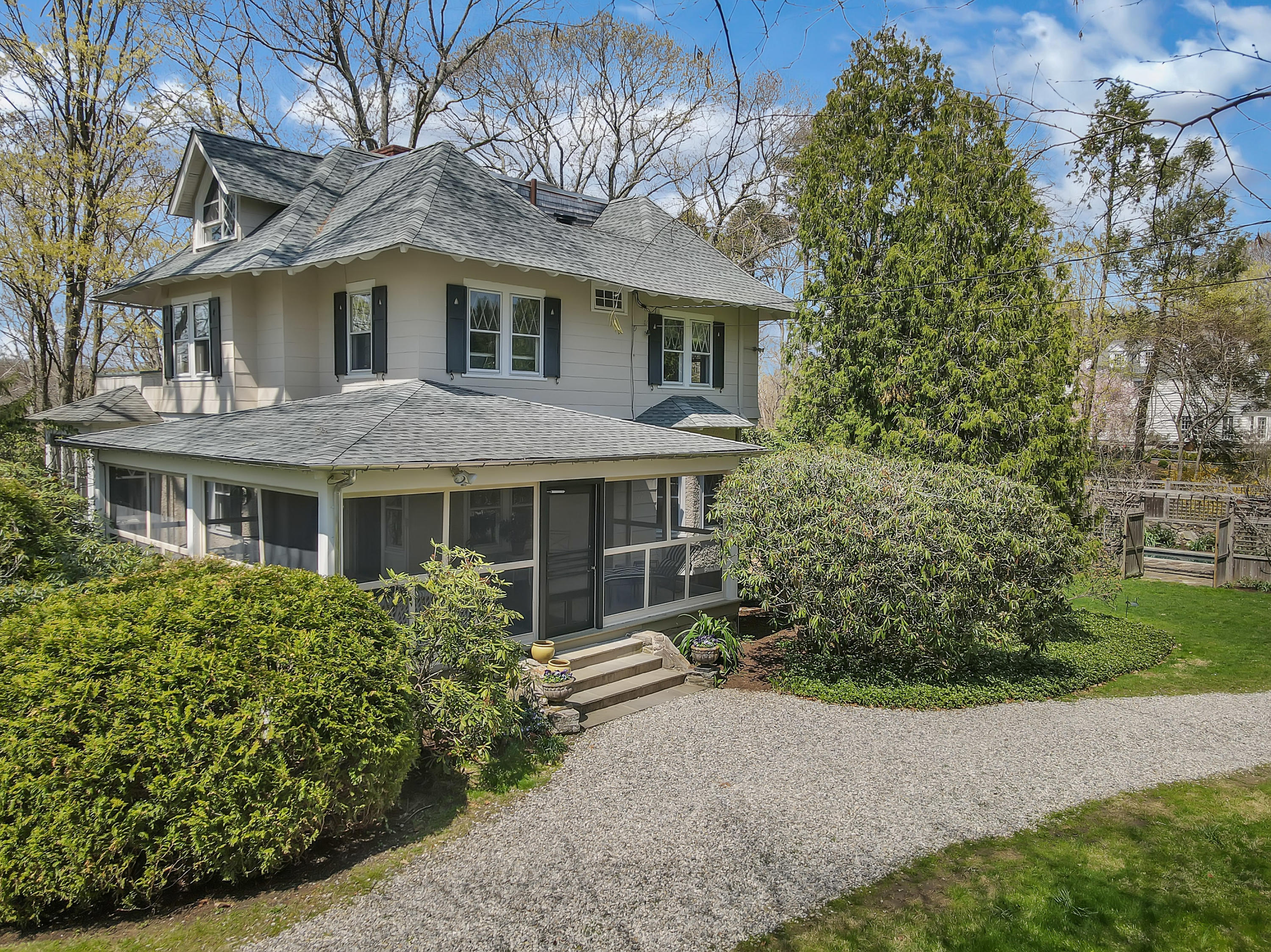 97 Hillcrest Park Road Old Greenwich, CT 06870 - Photo 3 of 25 a front view of a house with a garden