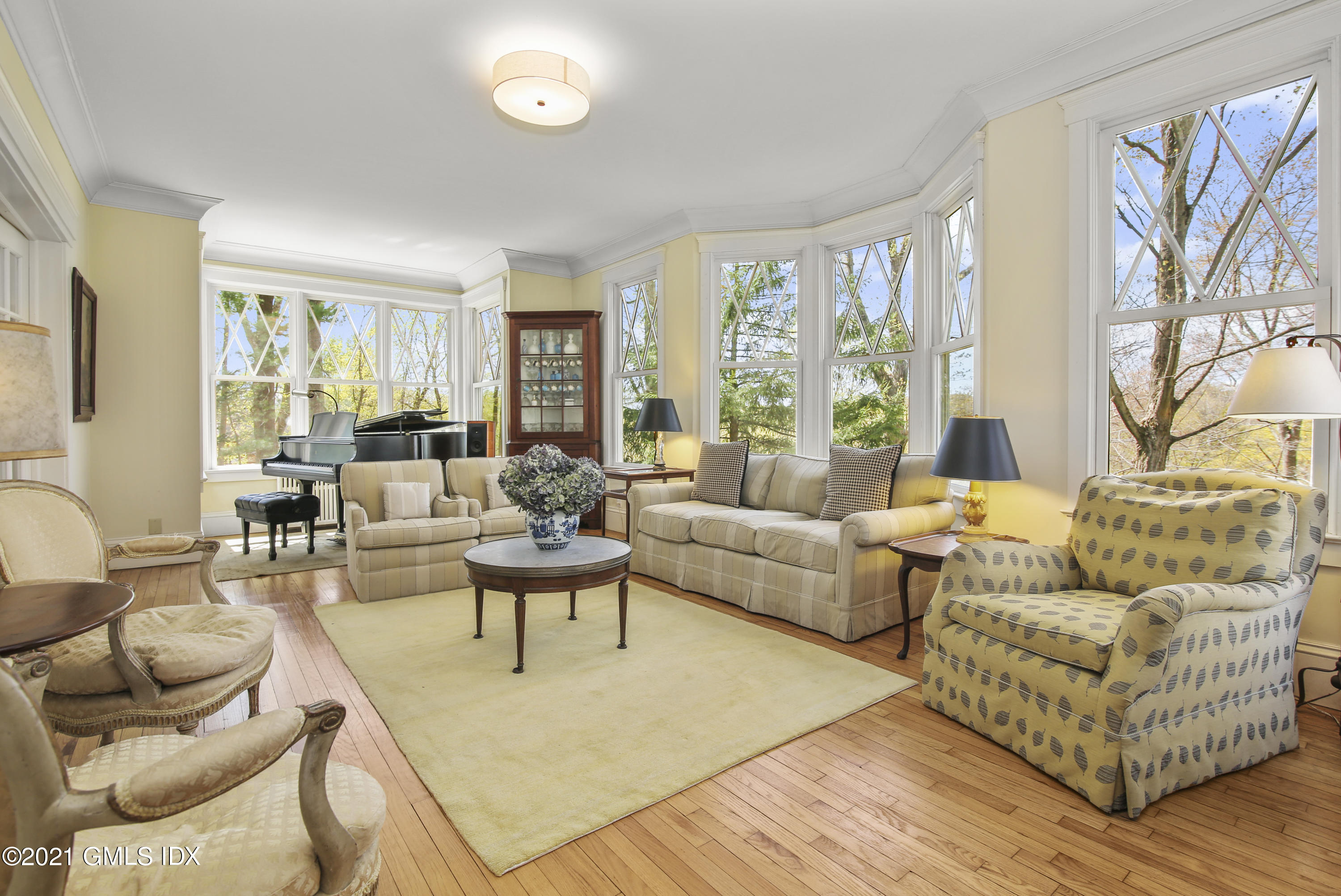 97 Hillcrest Park Road Old Greenwich, CT 06870 - Photo 9 of 25 a living room with furniture and a large window