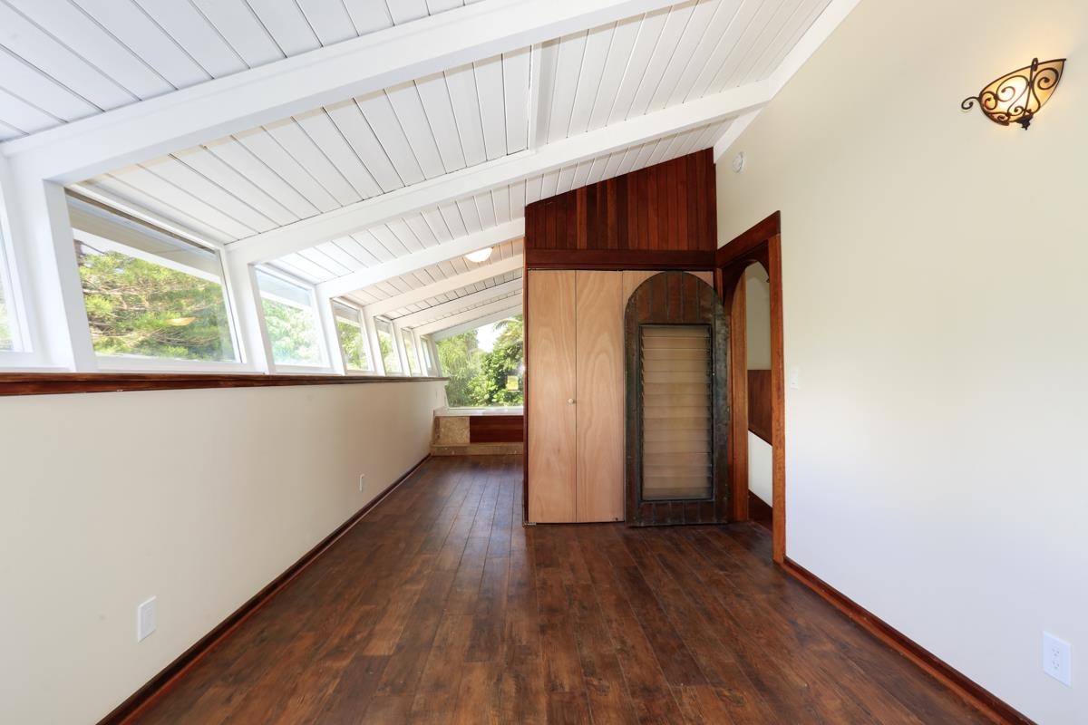 5045 Lower Honoapiilani Road, Unit 6 Lahaina, HI 96761 - Photo 17 of 30 a view of a hallway with wooden floor and windows