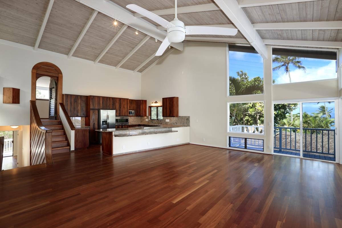 5045 Lower Honoapiilani Road, Unit 6 Lahaina, HI 96761 - Photo 9 of 30 a view of a livingroom with furniture and wooden floor