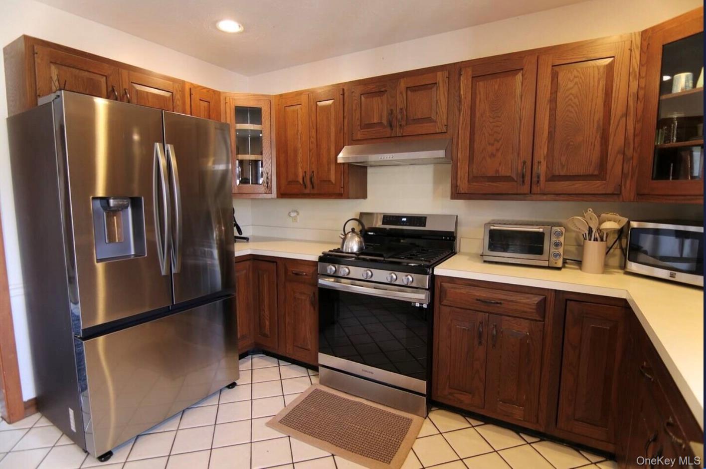 170 Maplecrest Road Windham, NY 12439 - Photo 13 of 36 a kitchen with stainless steel appliances granite countertop a refrigerator stove and cabinets