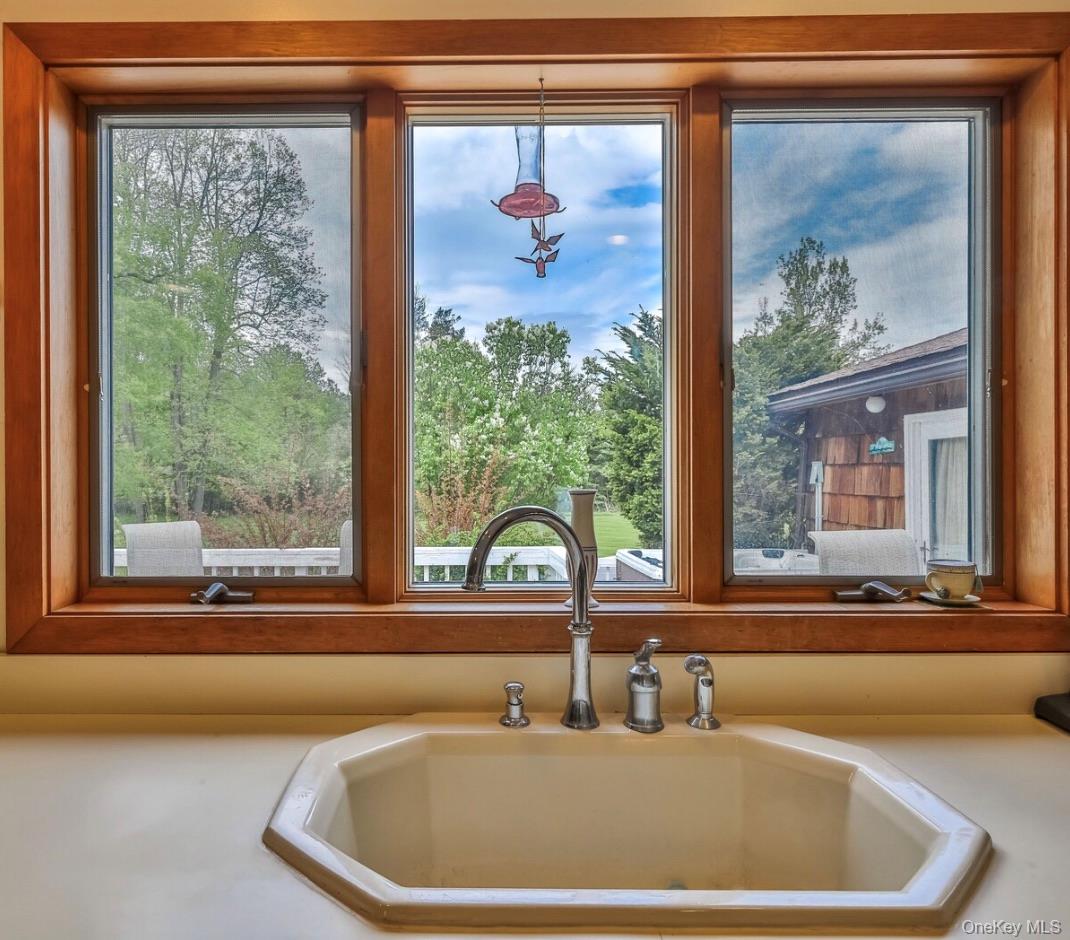 170 Maplecrest Road Windham, NY 12439 - Photo 15 of 36 a bathroom with a large window and a sink