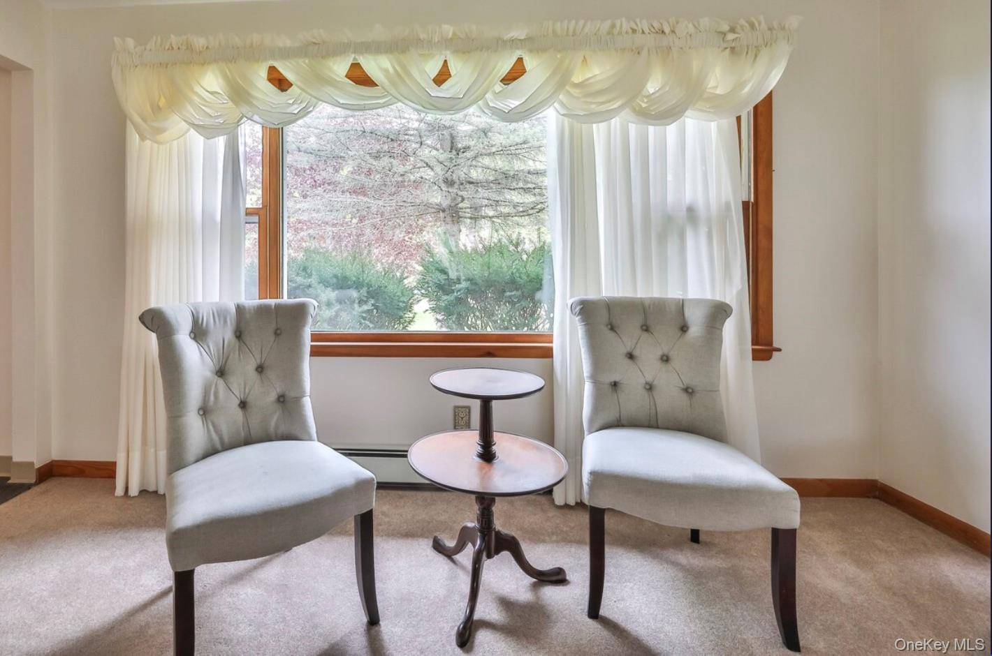 170 Maplecrest Road Windham, NY 12439 - Photo 18 of 36 a view of a dining room with furniture a chandelier and a window