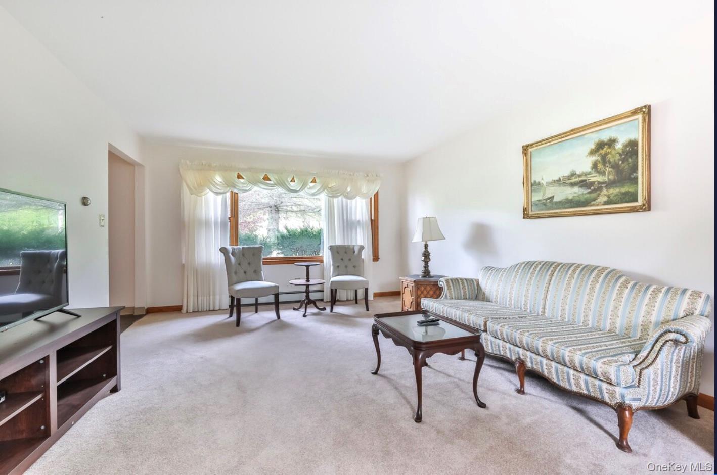 170 Maplecrest Road Windham, NY 12439 - Photo 21 of 36 a living room with furniture and a large window