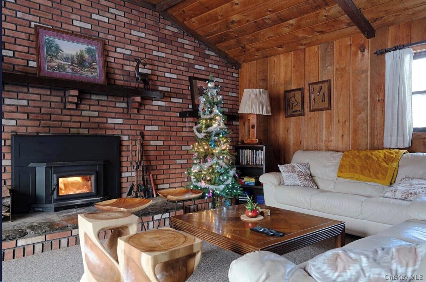 170 Maplecrest Road Windham, NY 12439 - Photo 32 of 36 a living room with furniture and a fireplace