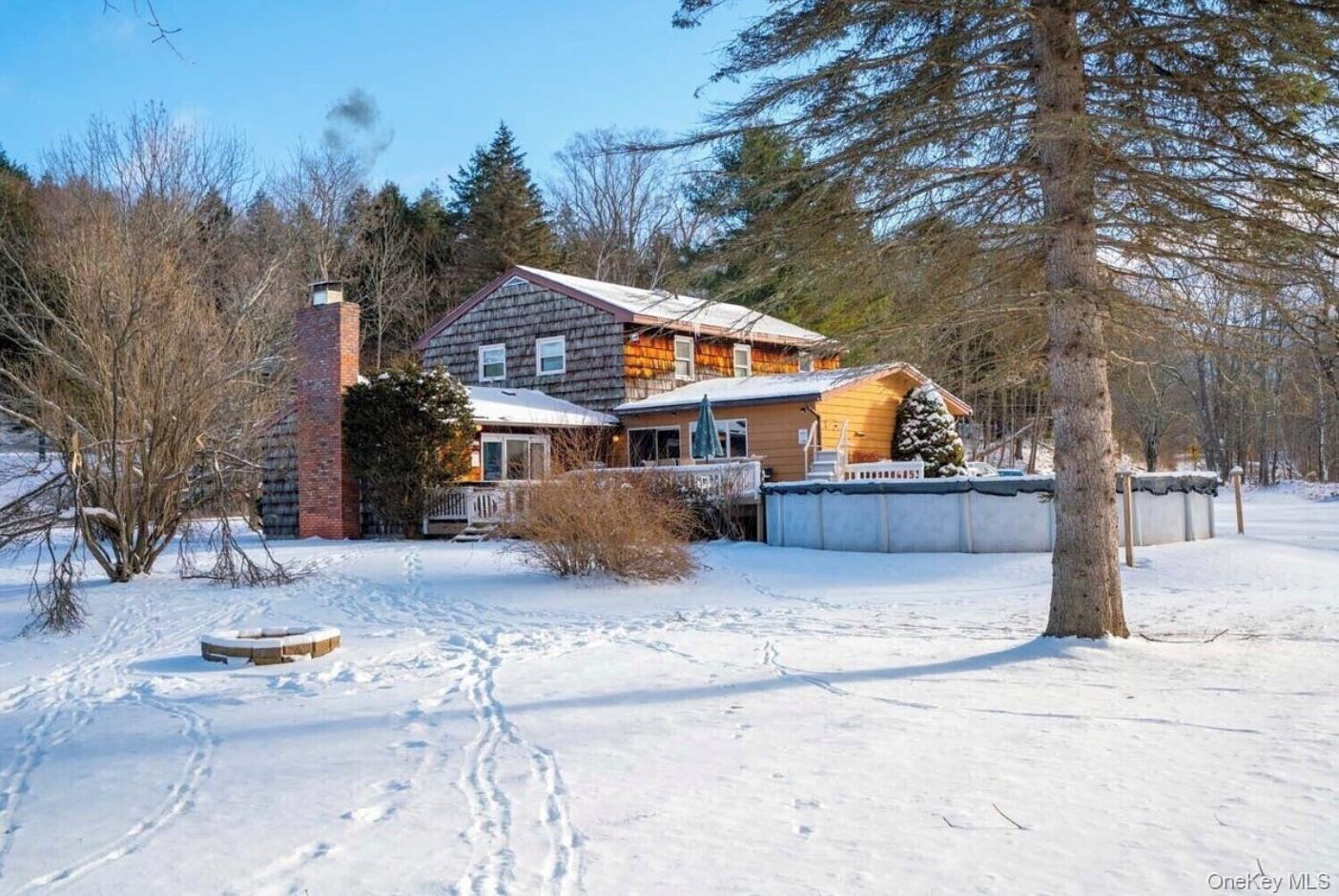 170 Maplecrest Road Windham, NY 12439 - Photo 36 of 36 a front view of a house with a yard covered in snow