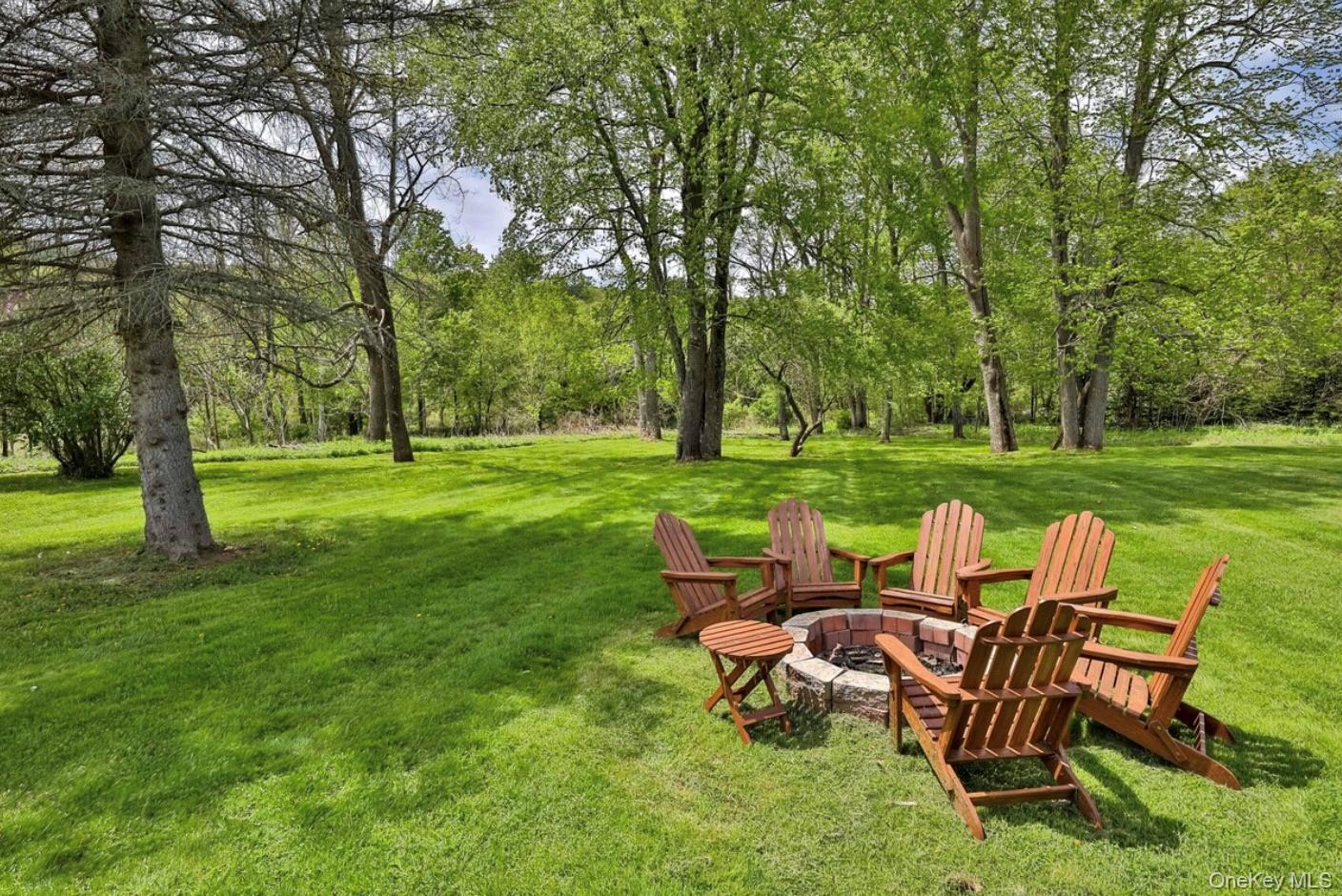 170 Maplecrest Road Windham, NY 12439 - Photo 7 of 36 a view of a big yard with a table and chairs