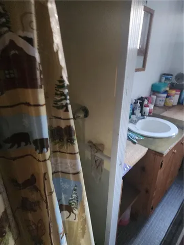 a bathroom with a sink and mirror