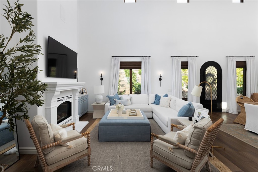 33240 La Serena Way Temecula, CA 92591 - Photo 11 of 75 a living room with furniture a fireplace and a flat screen tv