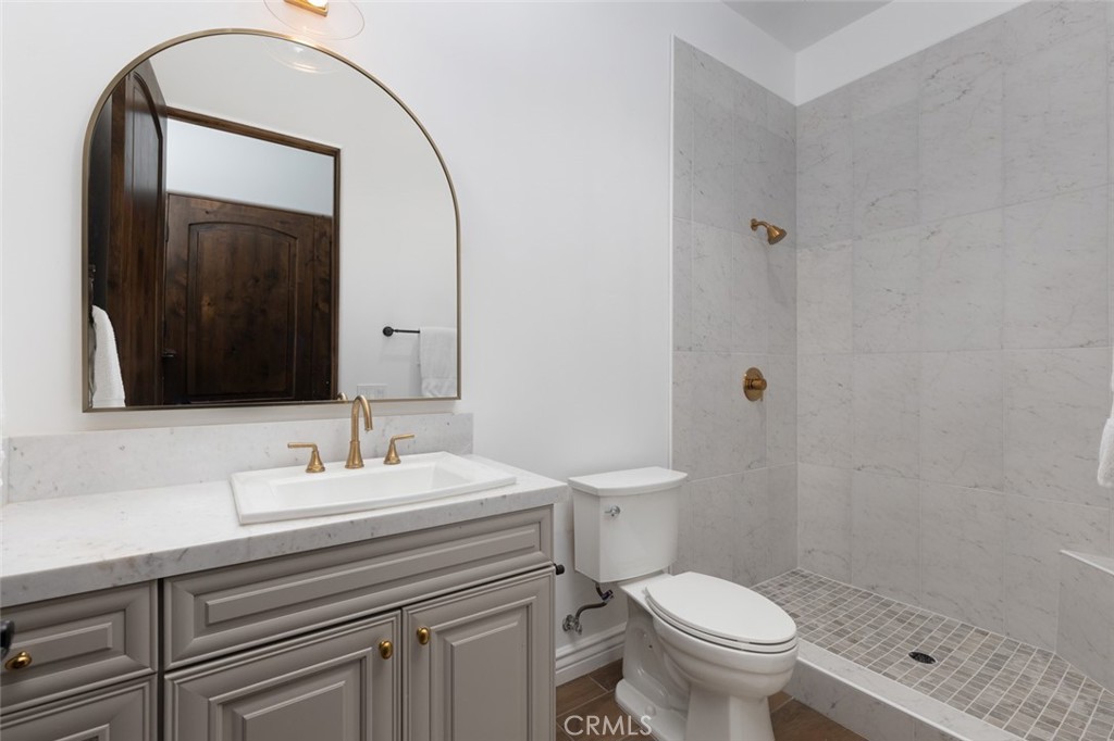 33240 La Serena Way Temecula, CA 92591 - Photo 28 of 75 a bathroom with a sink a toilet and mirror