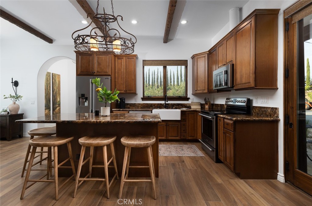 33240 La Serena Way Temecula, CA 92591 - Photo 41 of 75 a kitchen with stainless steel appliances a sink stove and refrigerator