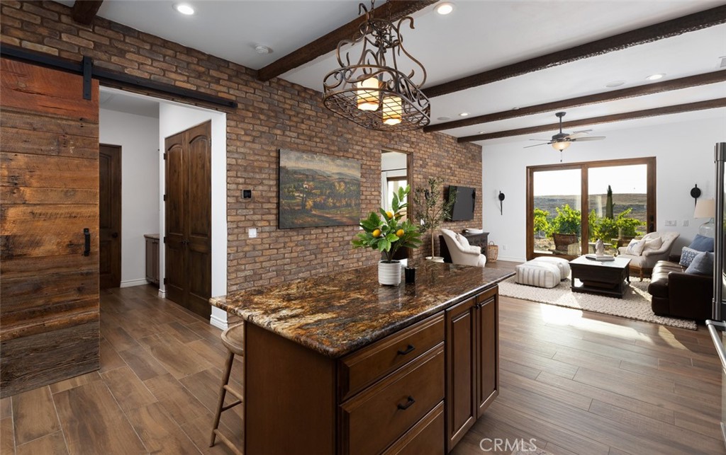 33240 La Serena Way Temecula, CA 92591 - Photo 42 of 75 a living room with granite countertop furniture and a chandelier