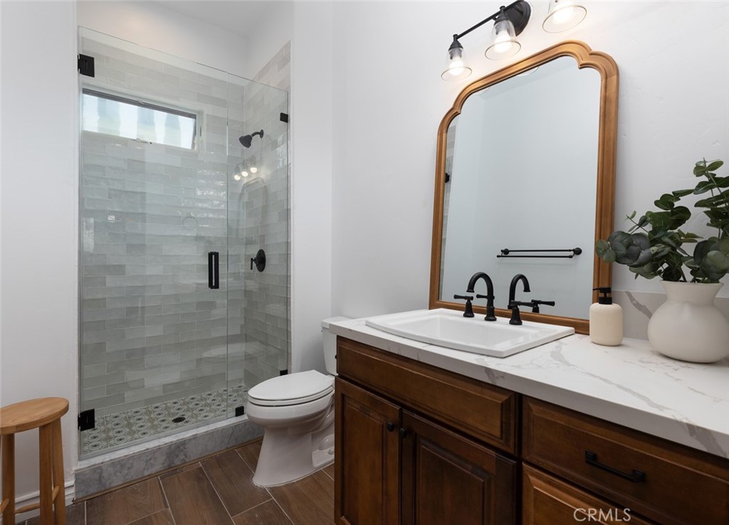 33240 La Serena Way Temecula, CA 92591 - Photo 47 of 75 a bathroom with a sink a toilet and shower